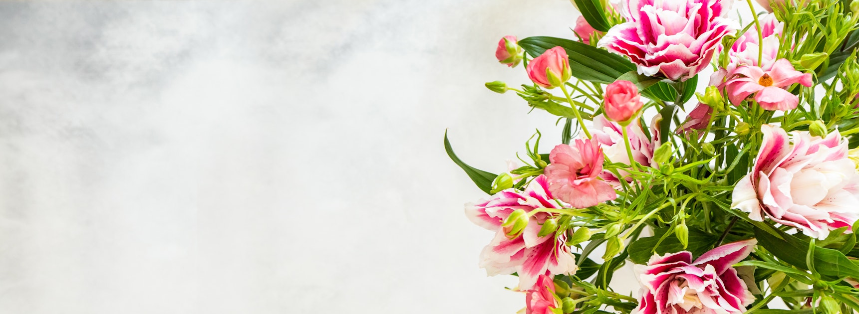 Delicate pink and white flowers arranged artistically, enhancing any space with elegance.