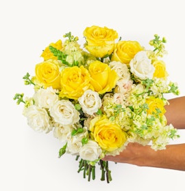 Bright and cheerful bouquet featuring yellow roses and white blooms, perfect for celebrations.